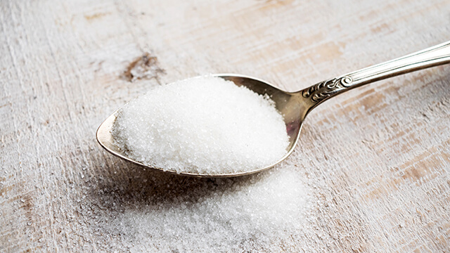 Artifical sweetener in metal spoon